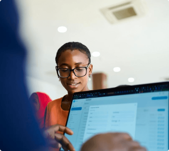 Event organizer reviewing registration data on a laptop